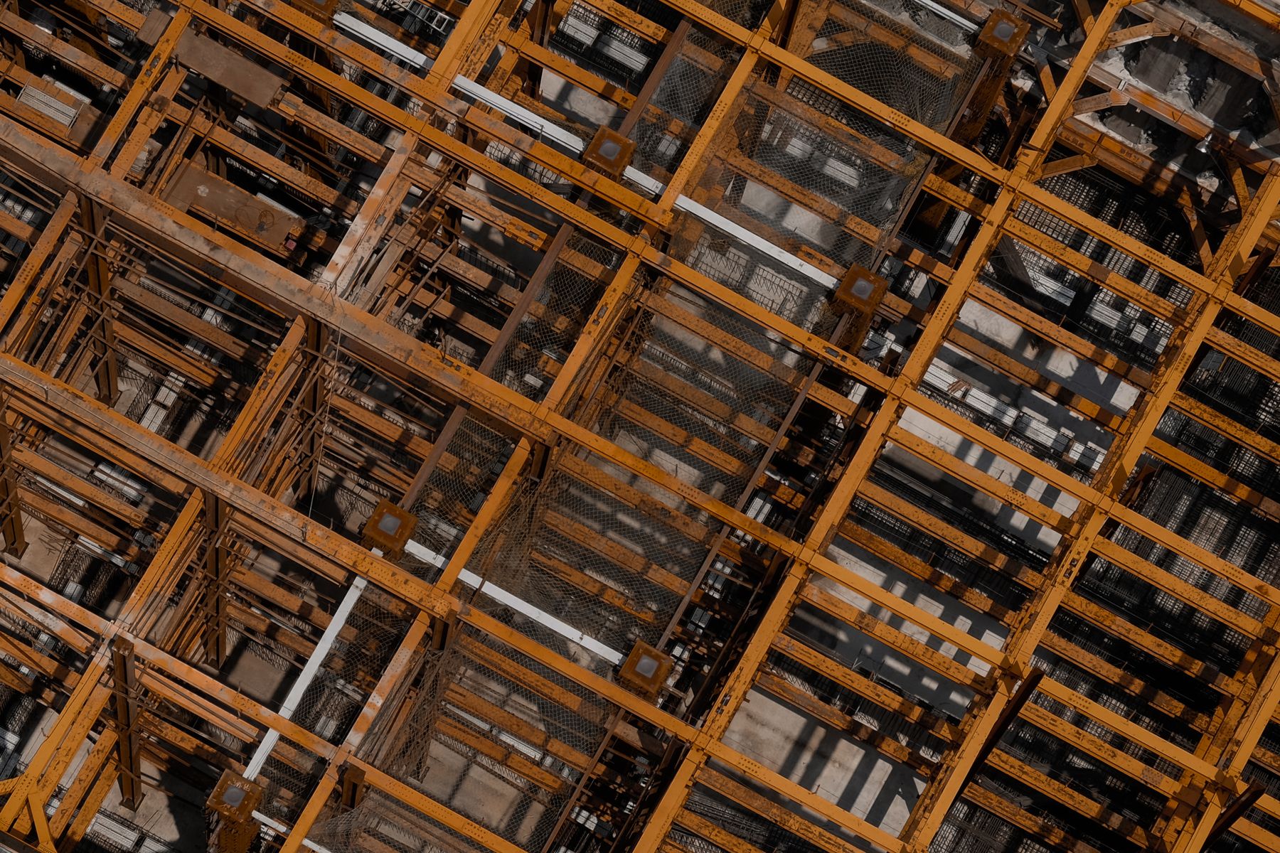 Aerial detail of structural steel framing on an active construction site